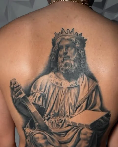 Religious figure realism tattoo on the back by Magdalena Davis
