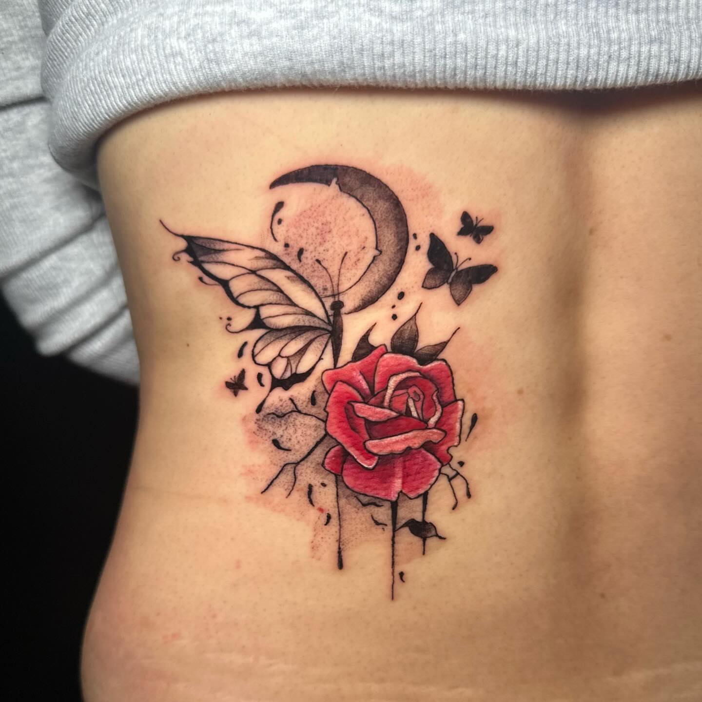 Rose and butterfly dotwork tattoo on the ribs by Sam, Mount Laurel, New Jersey