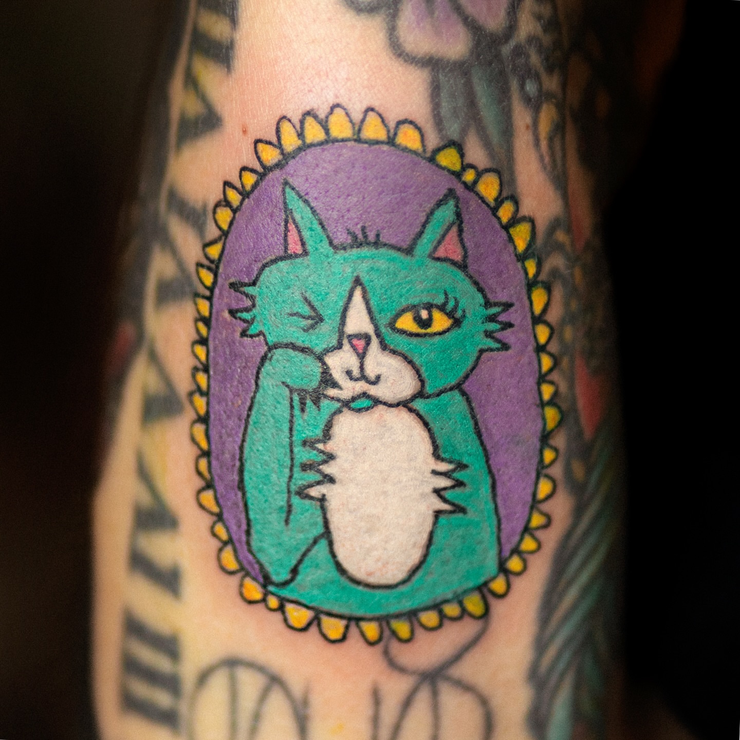 Cat illustrative tattoo on the forearm by Flash Boom Bang Tattoo