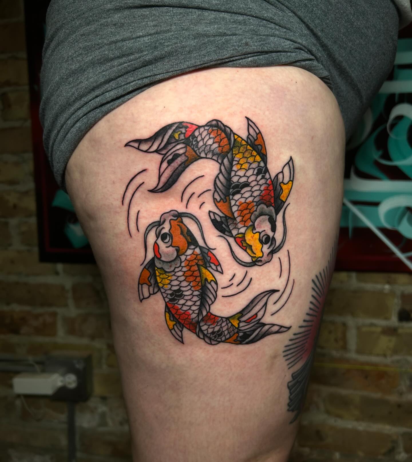 Koi fish American traditional tattoo on the thigh by Alycia