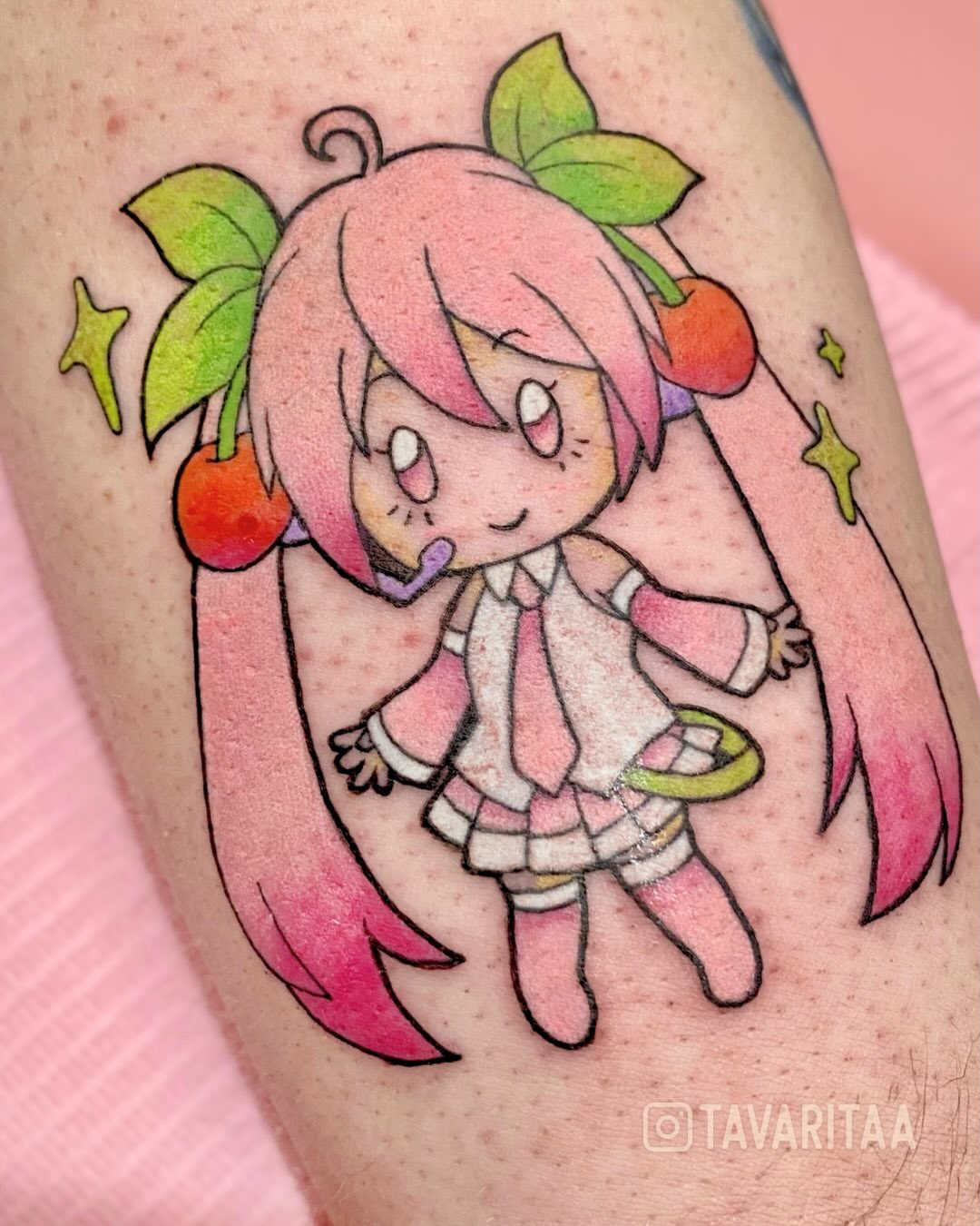 Chibi girl with cherries watercolor tattoo on the forearm by Tavarita