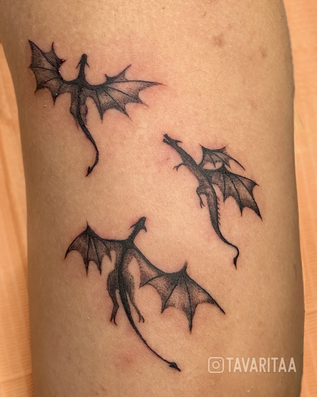 Dragons black and grey tattoo on the forearm by Tavarita