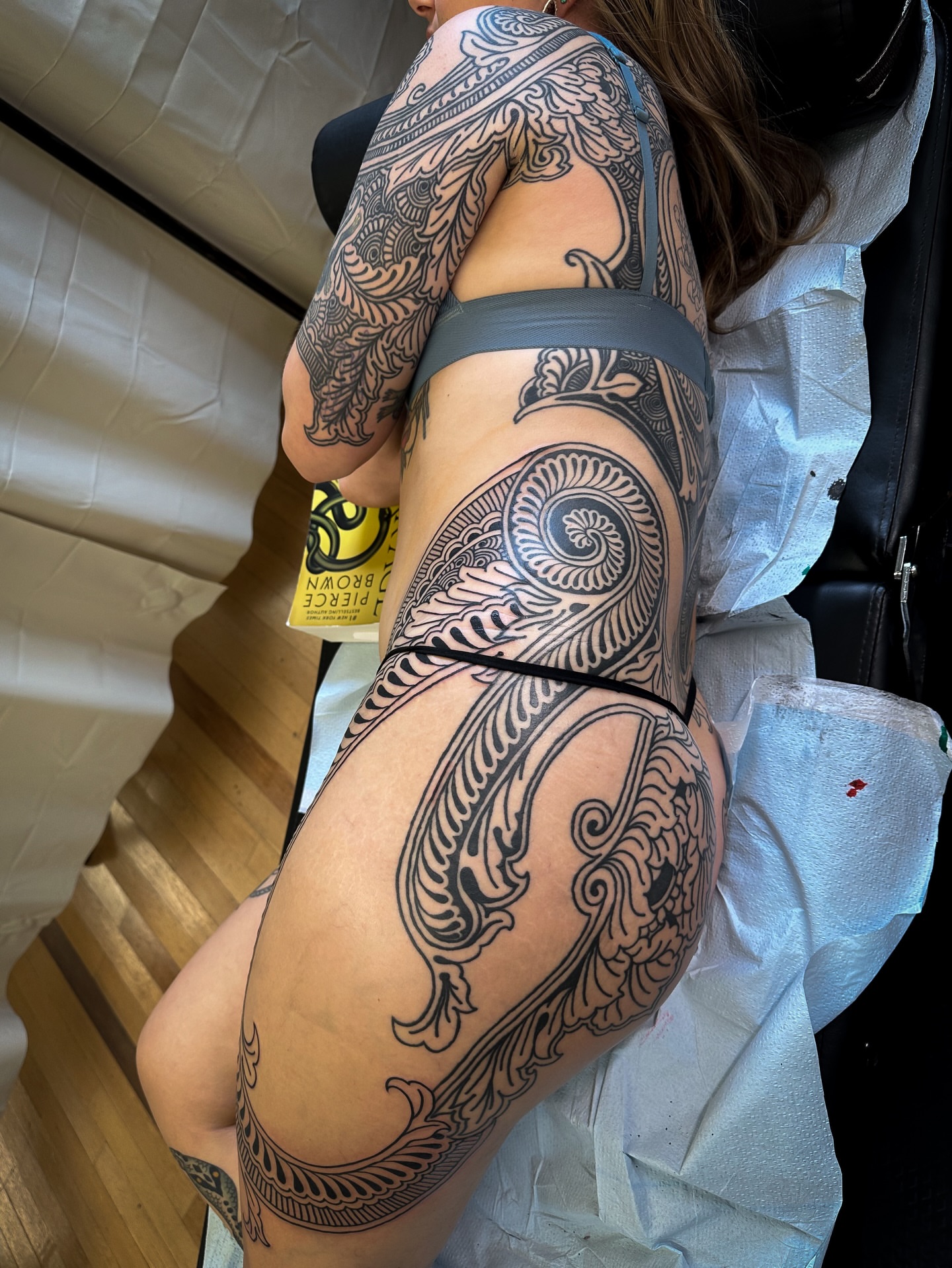 Floral pattern ornamental tattoo on the thigh by Colin Kenji Baker, San Jose, California