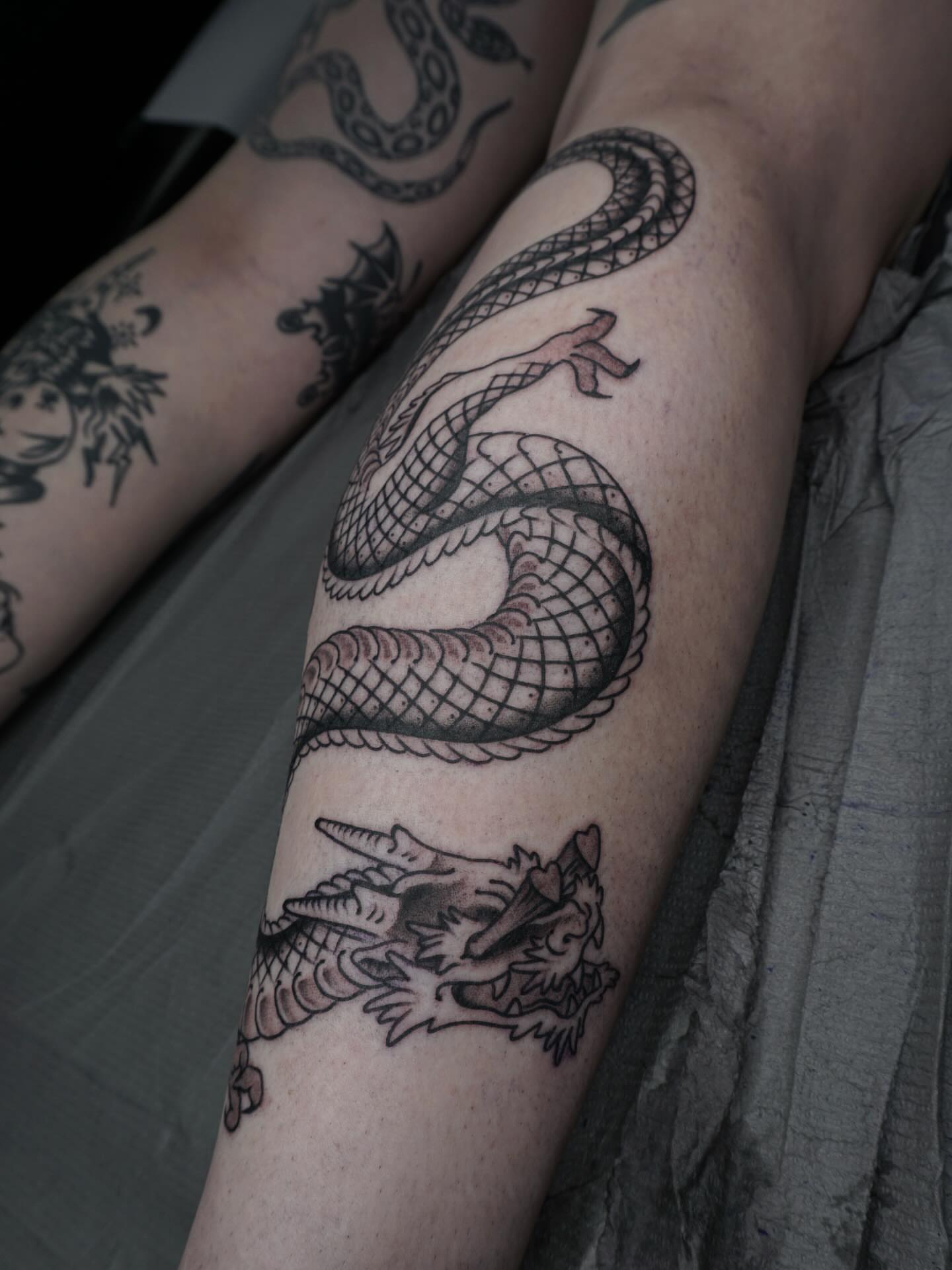 Dragon realism tattoo on the forearm by Sarah Christine Tattoo, Calgary, Alberta