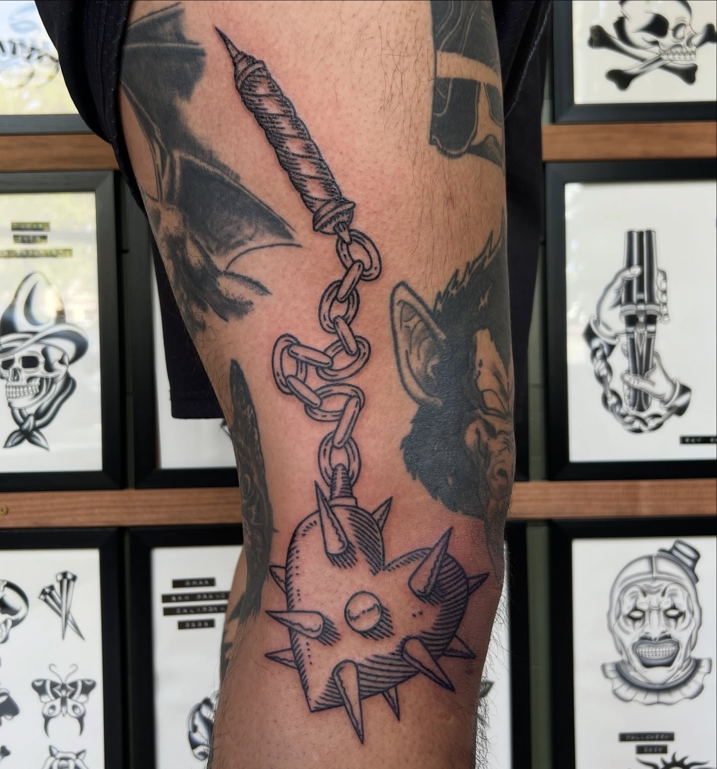 Anchor chain and spiked ball black and grey tattoo on the forearm by @syrenbier, San Francisco, California