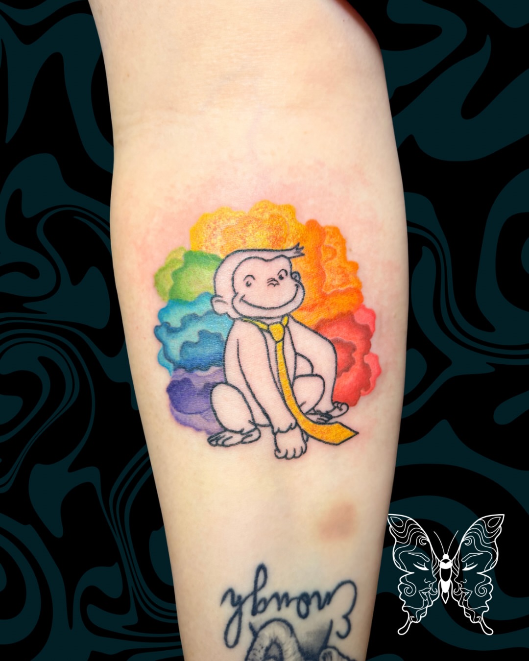 Curious George illustrative tattoo on the forearm by Nicci