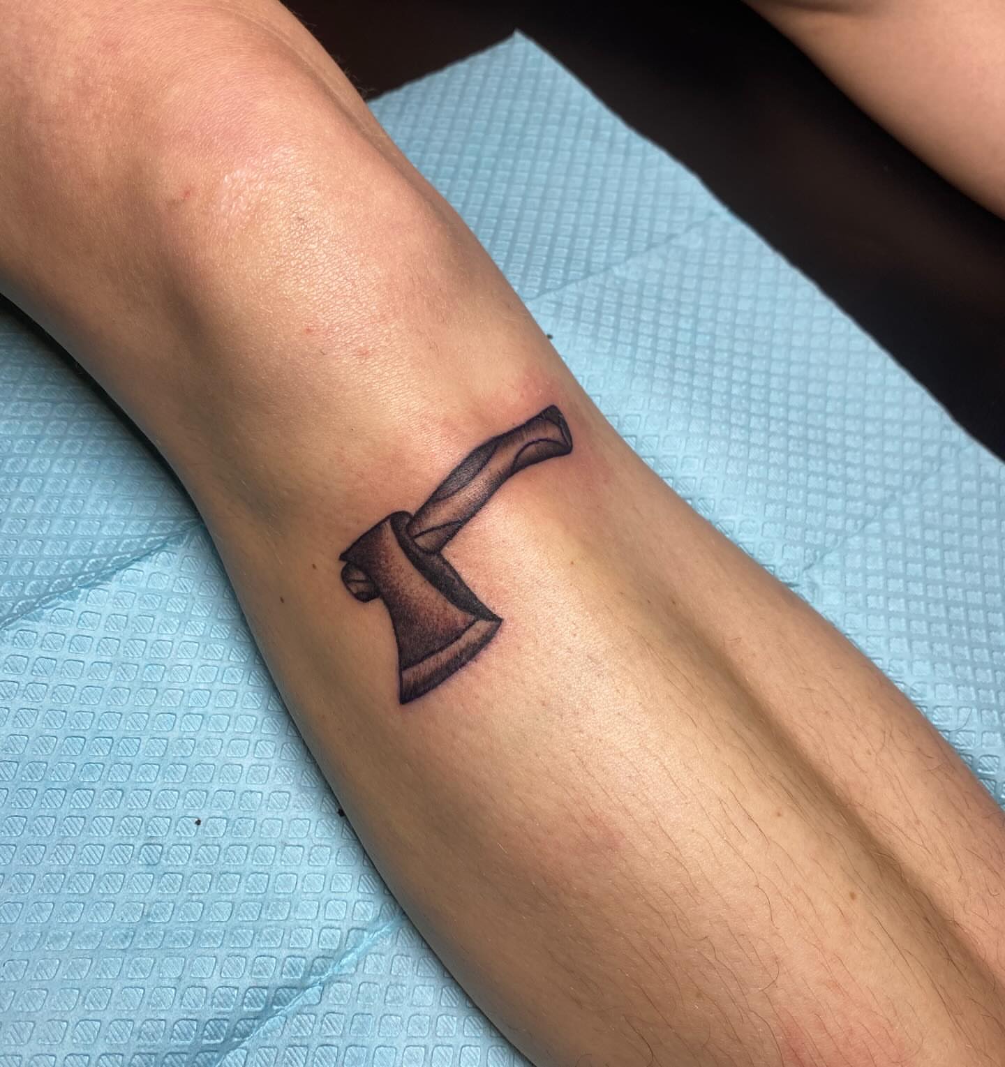 Axe black and grey tattoo on the forearm by Kyle Mitchell, Cincinnati