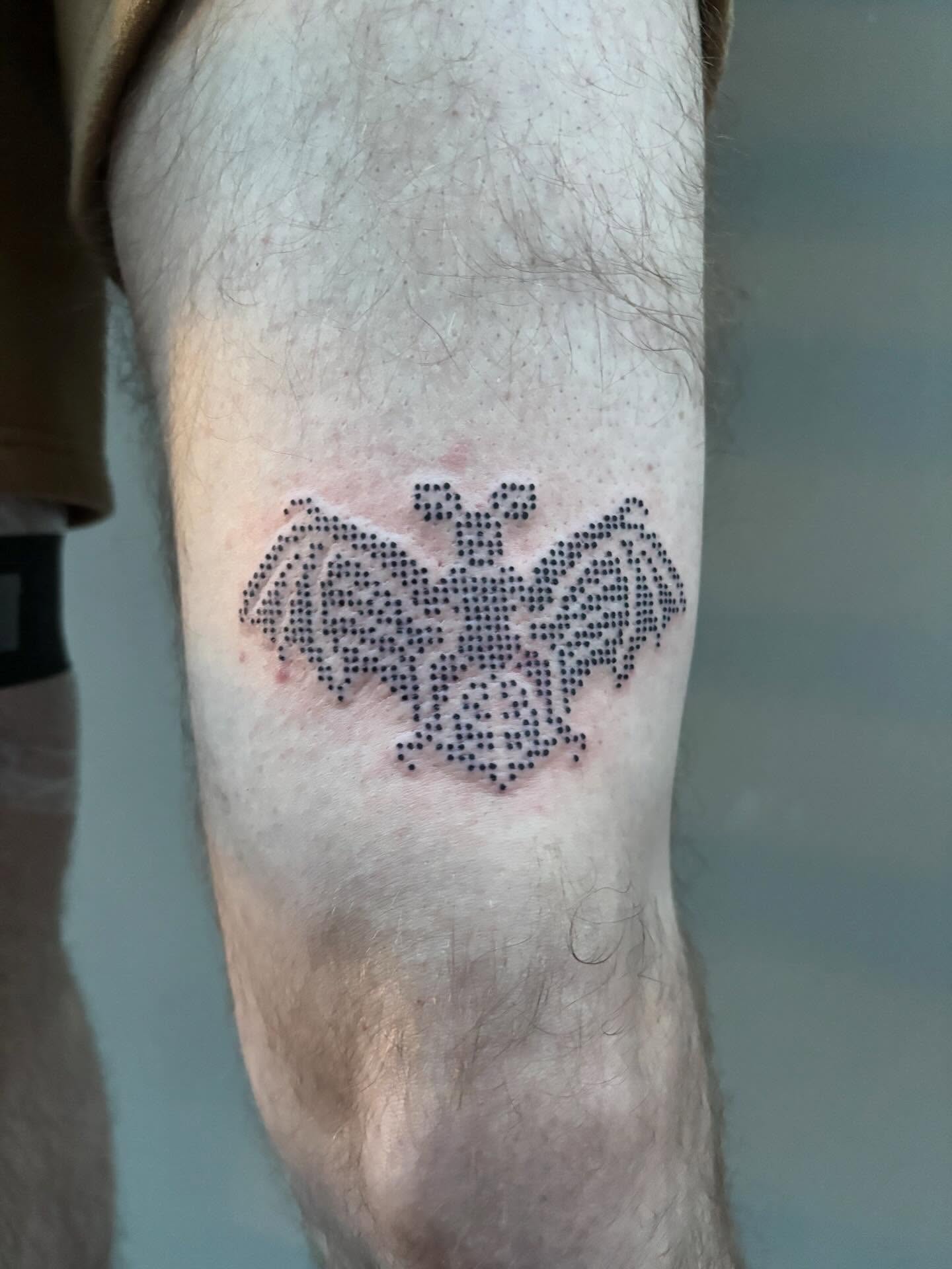 Bat dotwork tattoo on the forearm by Turner