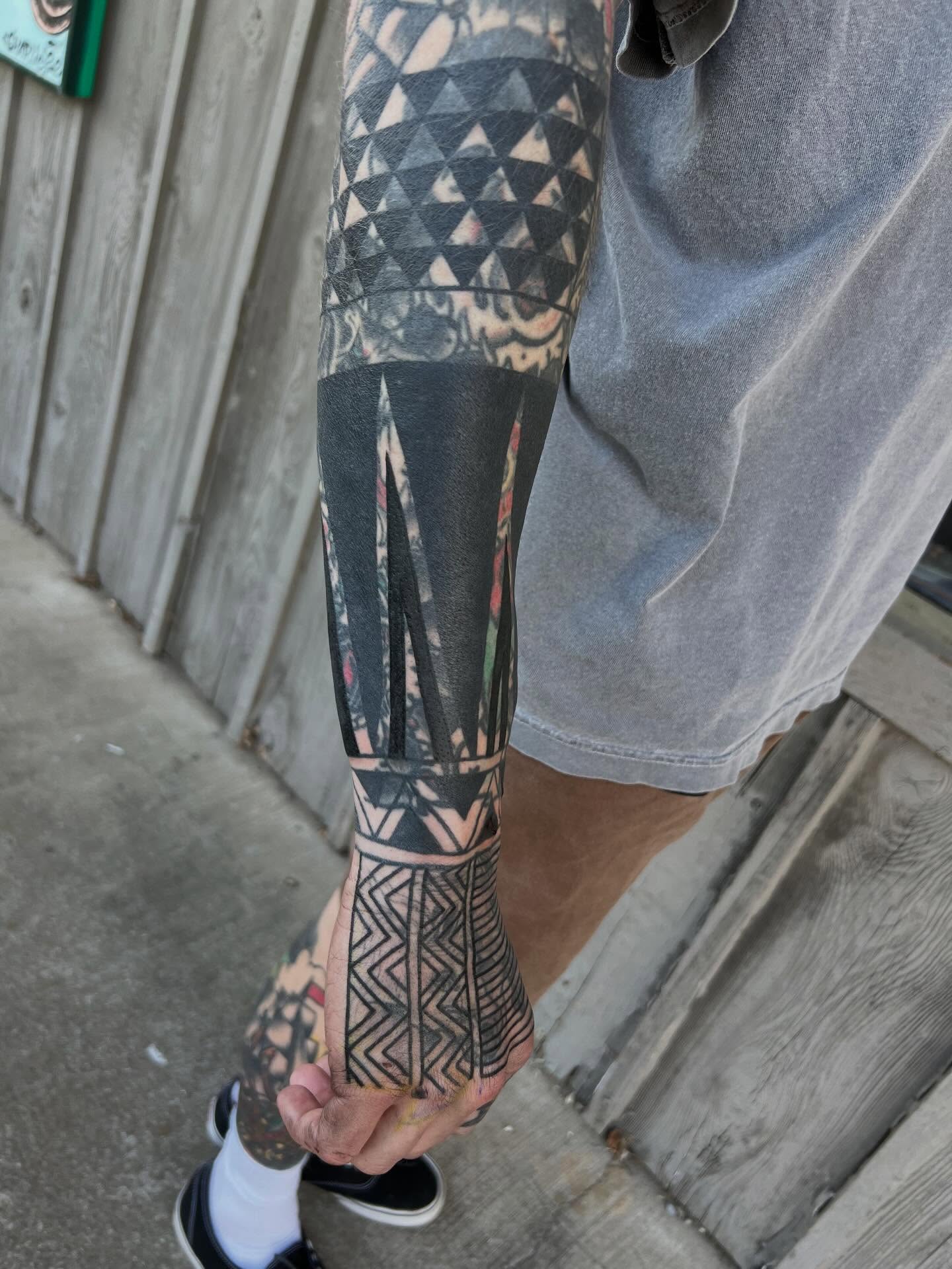Tribal pattern tribal tattoo on the forearm by Charlie Campanella