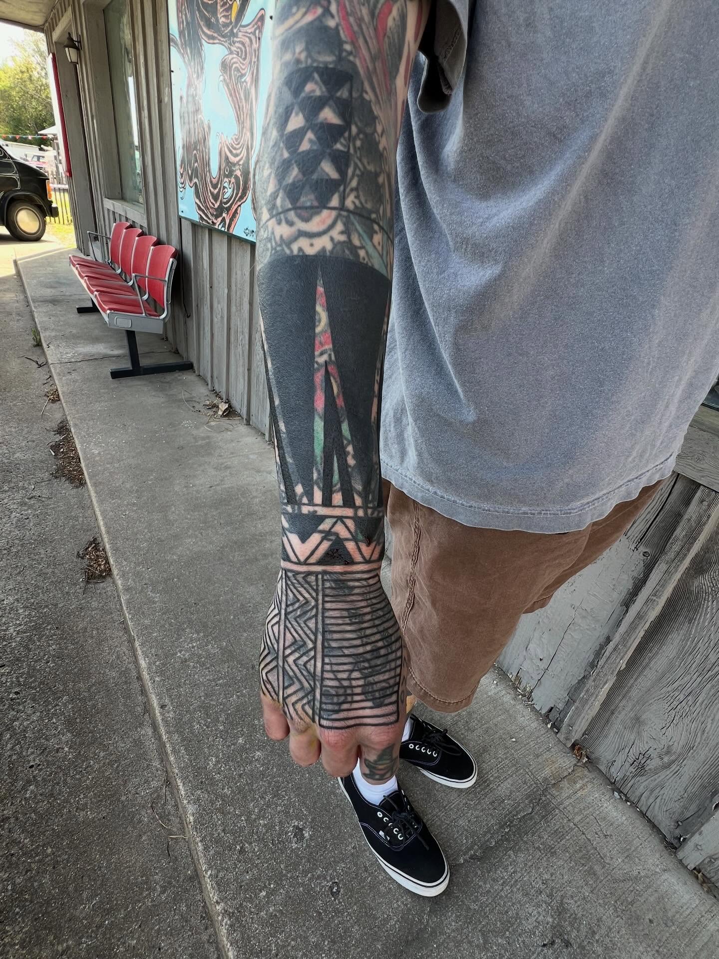 Tribal pattern tribal tattoo on the forearm by Charlie Campanella