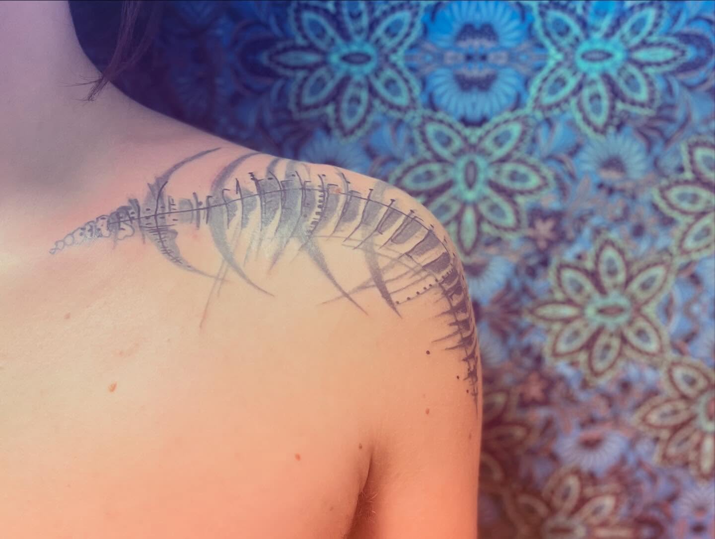 Rib cage black and grey tattoo on the shoulder by La Main Bleue