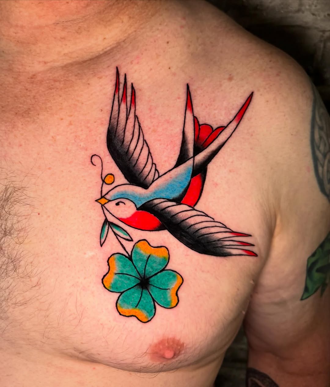 Swallow and clover fine line tattoo on the chest by @michaelryan_tattoo