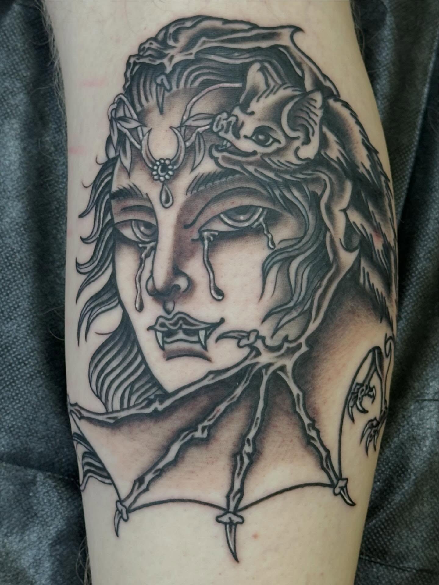Gothic woman with bat wings realism tattoo on the forearm by Wesley Lam