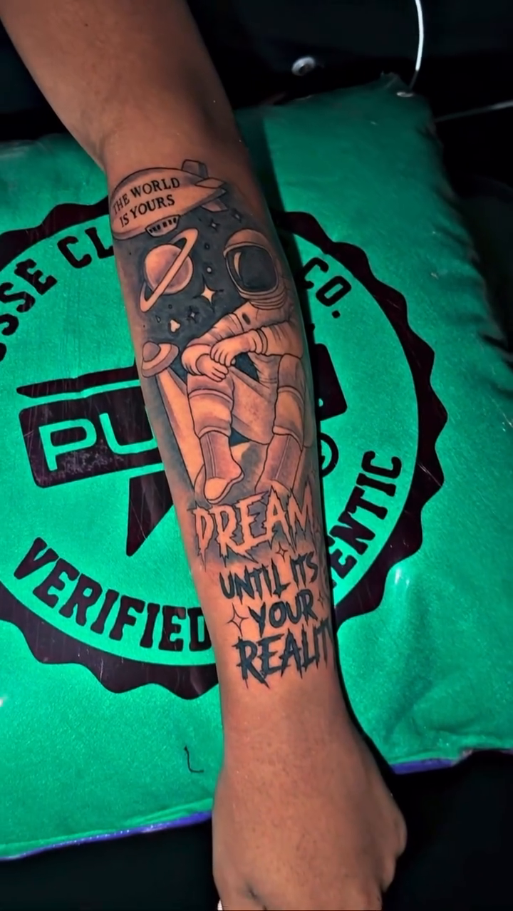 Astronaut with text realism tattoo by Atlanta Tattoo Artist βπ½