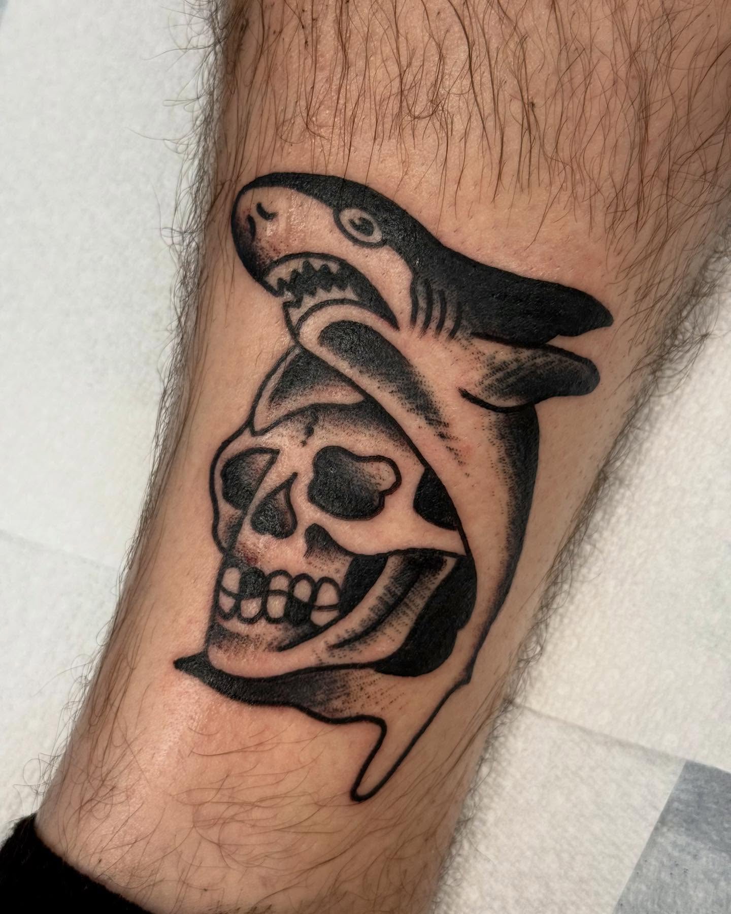 Shark and skull black and grey tattoo on the forearm by Jesse Boss, Nashville, Tennessee