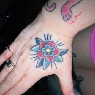Flower American traditional tattoo on the hand by jordy, Philadelphia, Pennsylvania