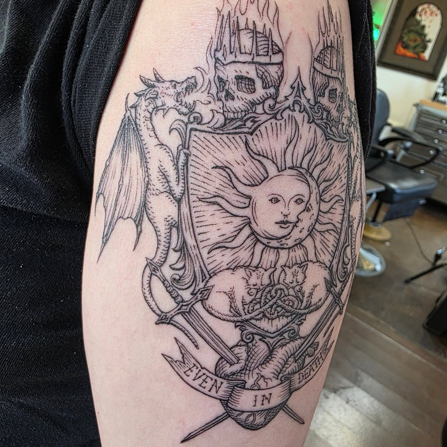 Solar deity black and grey tattoo on the forearm by Keith Countryman, Fort Worth, Texas
