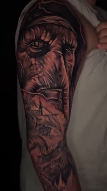 Old man's face and stormy sea realism tattoo by Christian Mulvey