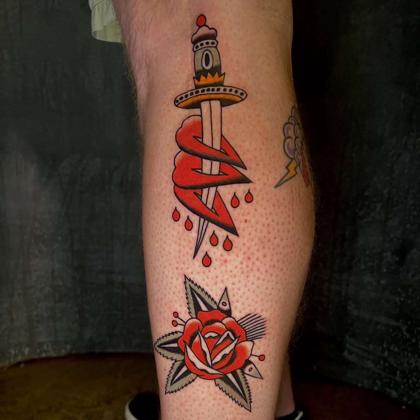 Sword and snake American traditional tattoo on the forearm by Andrew Storm