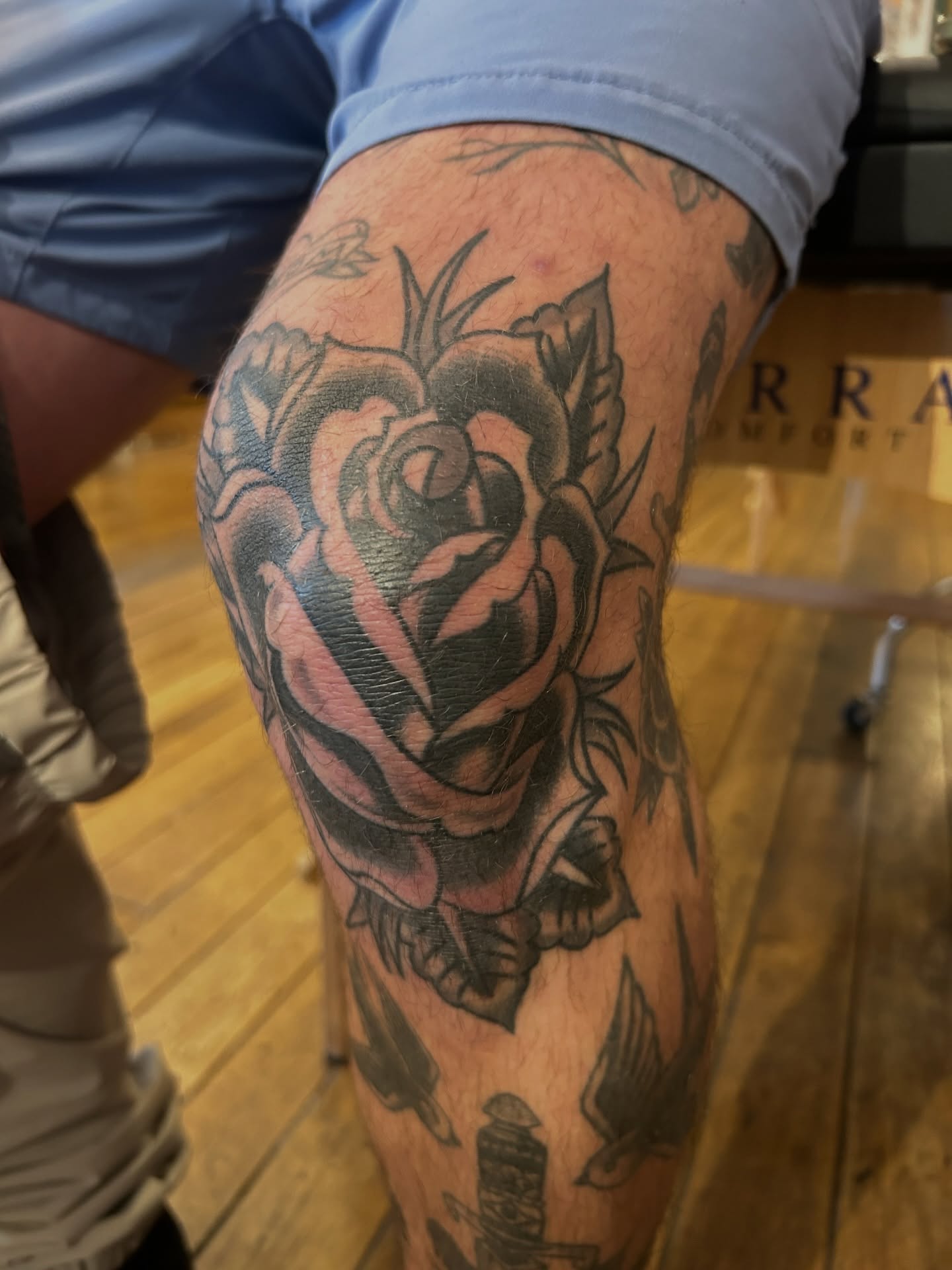 Rose American traditional tattoo on the thigh by Eric Caudill, Indianapolis, Indiana