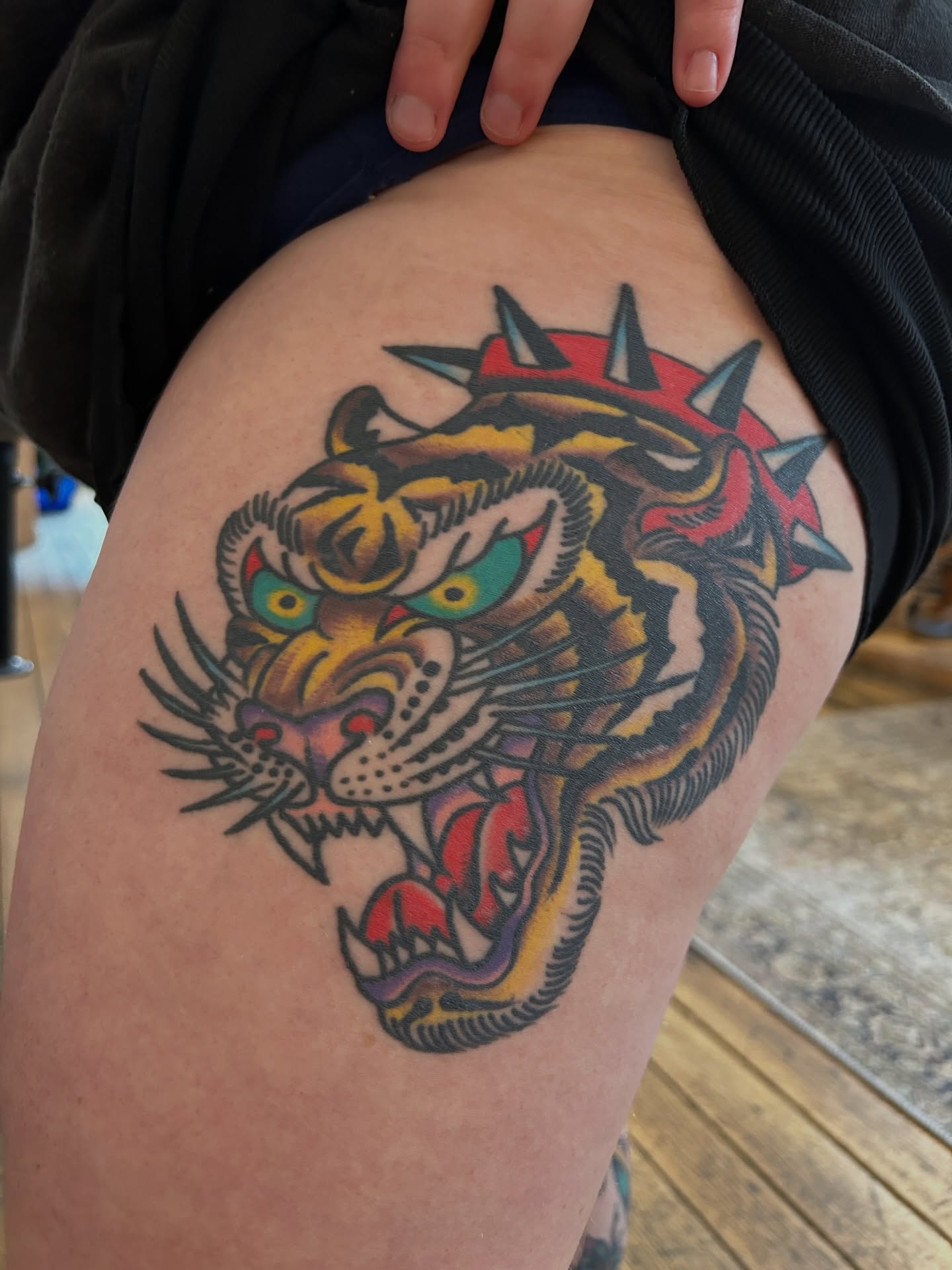 Tiger American traditional tattoo on the thigh by Eric Caudill, Indianapolis, Indiana
