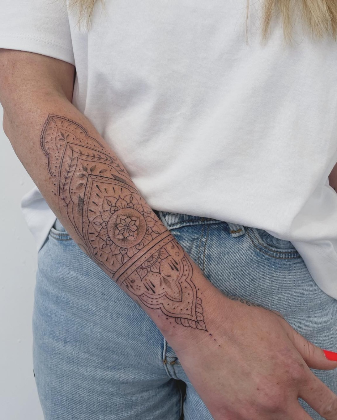 Mandala dotwork tattoo on the forearm by Mike Nance
