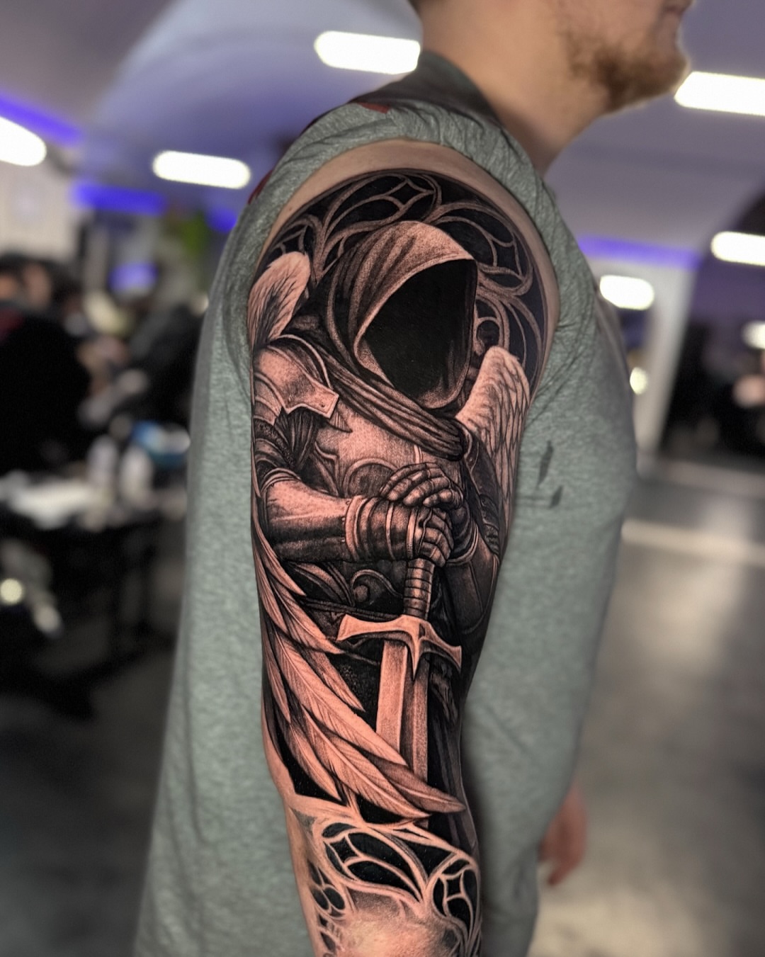 Hooded knight realism tattoo on the forearm by Mike Nance