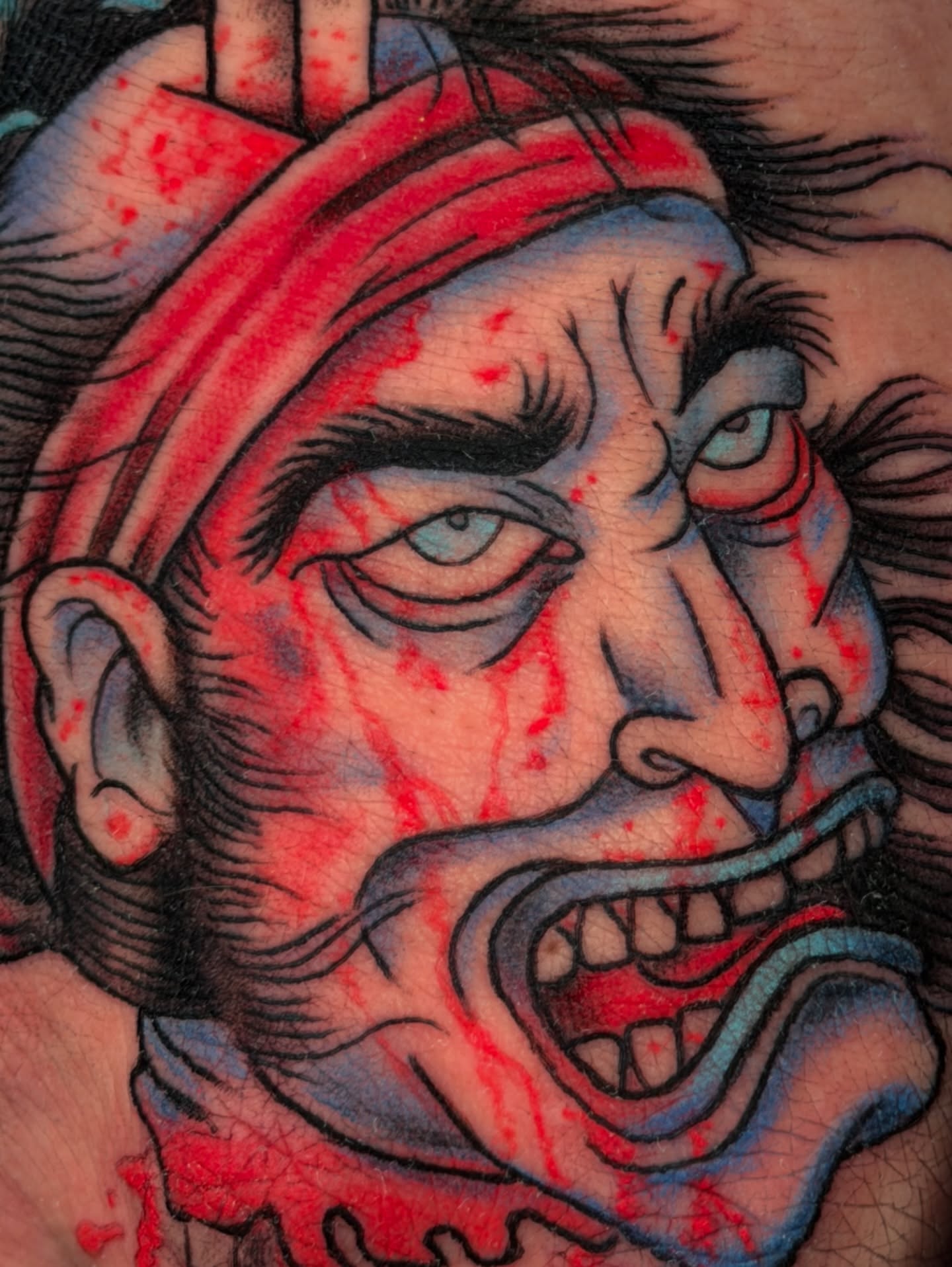 Angry man American traditional tattoo on the head by Tattoo Artist Los Angeles