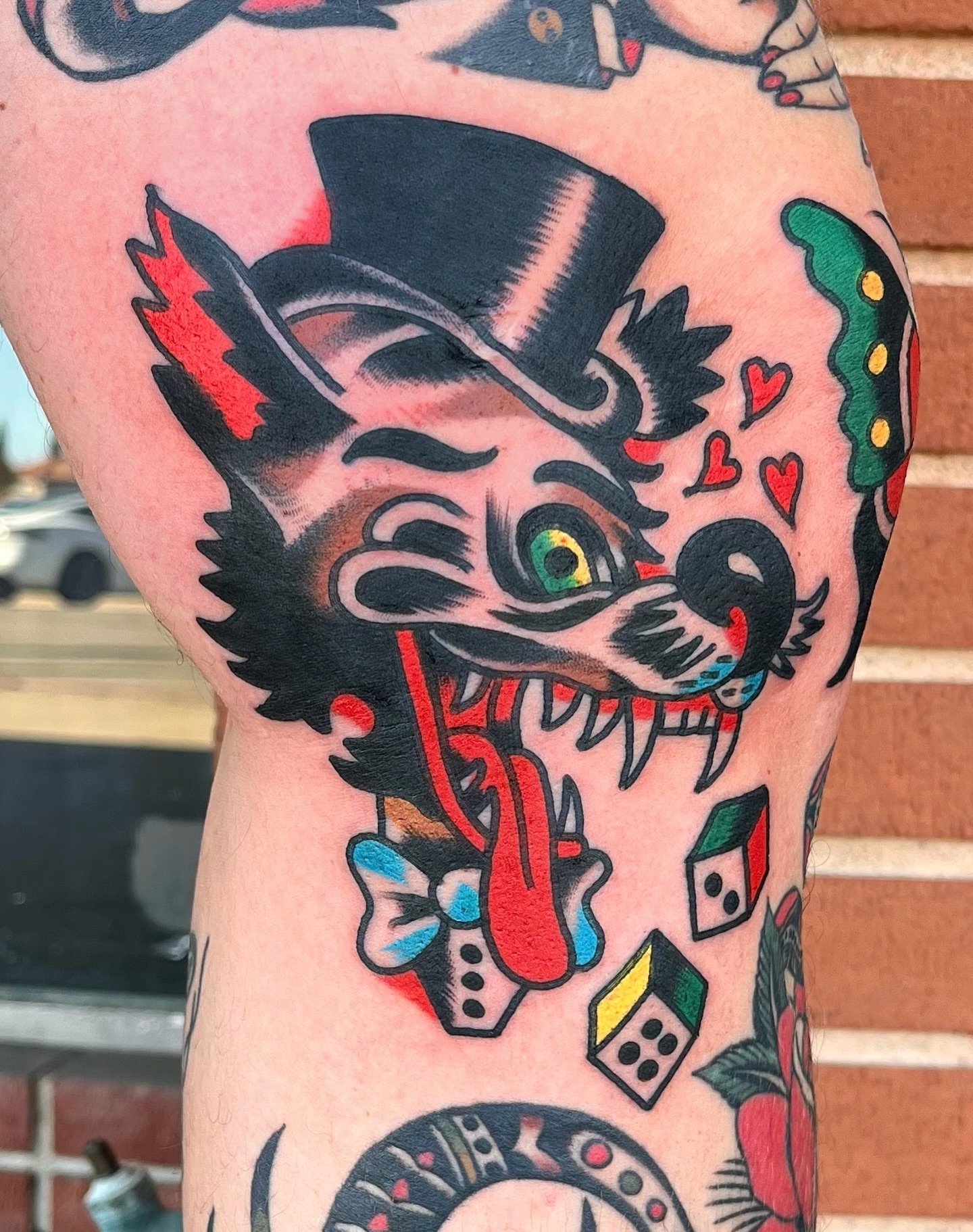Clown cat American traditional tattoo on the forearm by Traditional Tattooing