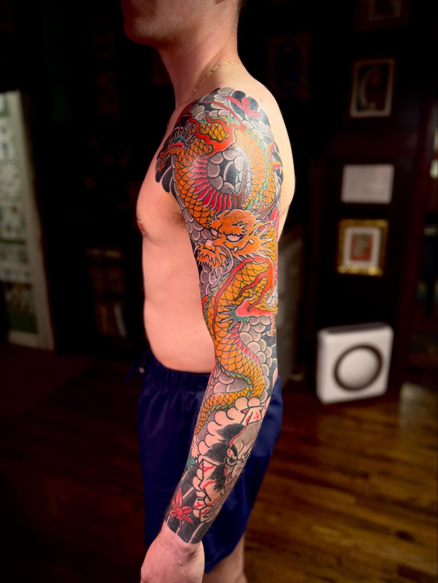 Dragon japanese irezumi tattoo on the upper arm by Jason Eisenberg