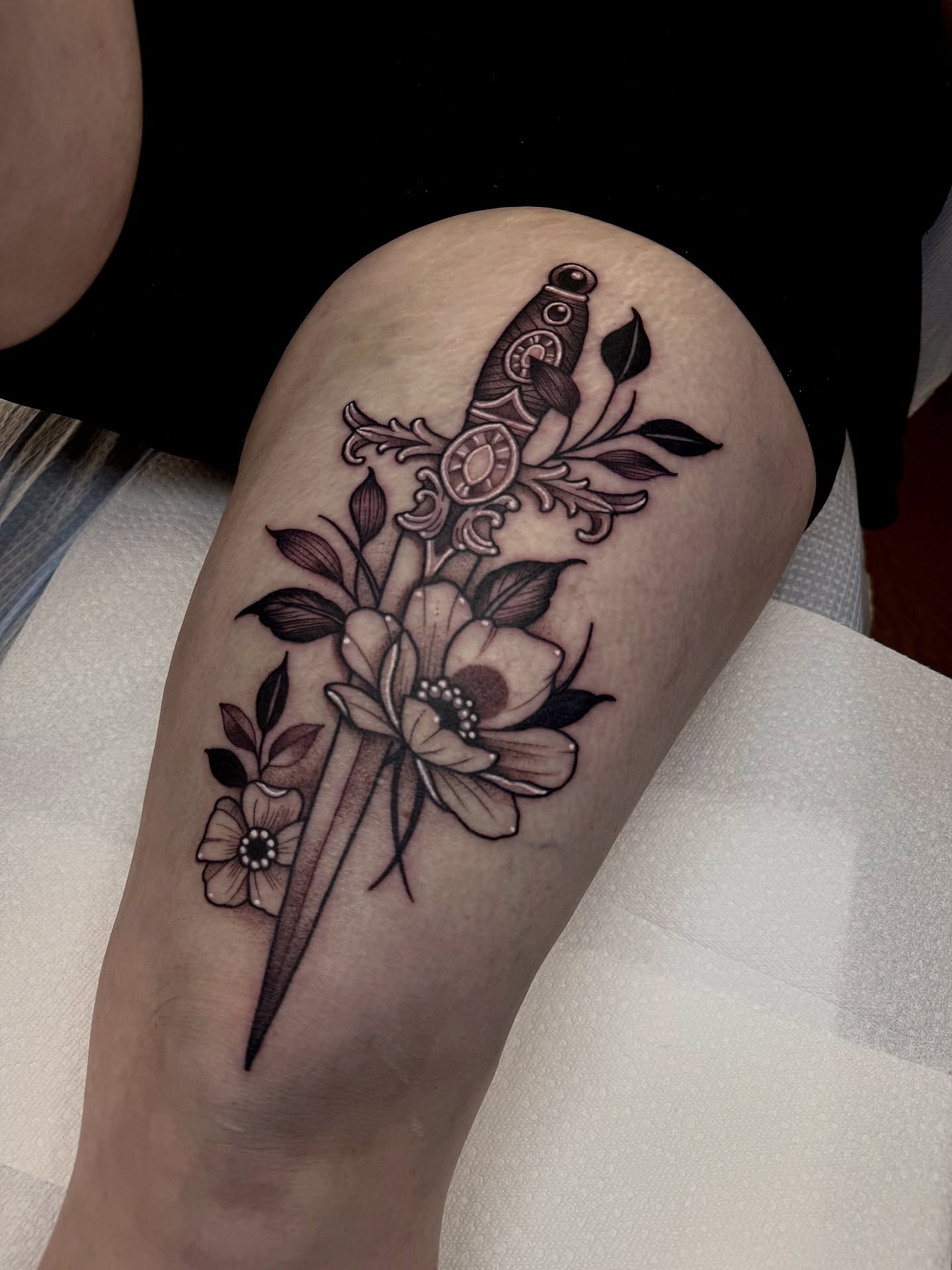 Sword and flowers ornamental tattoo on the thigh by ⚡️ Krissy Fabis ⚡️