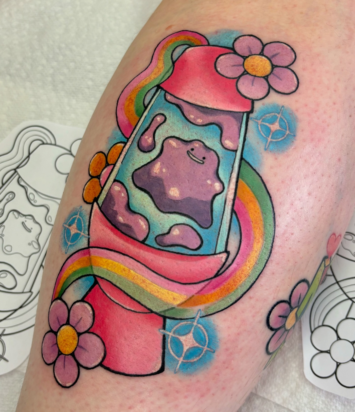 Milkshake new school tattoo on the upper arm by Lilac Rose