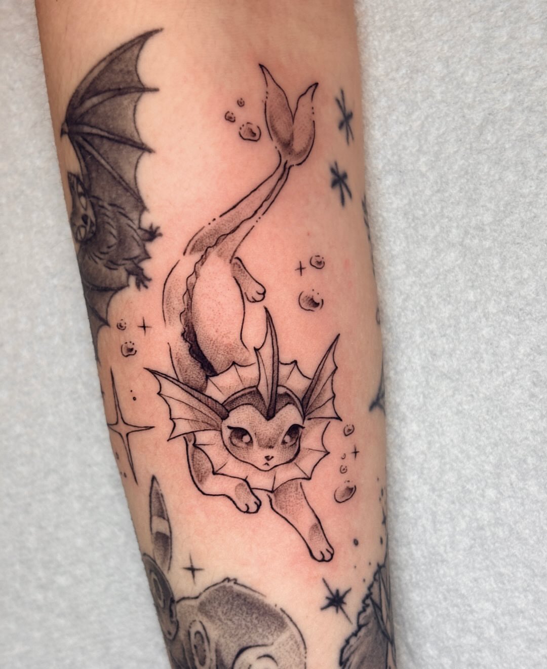 Eevee dotwork tattoo on the forearm by jo, Wichita, Kansas