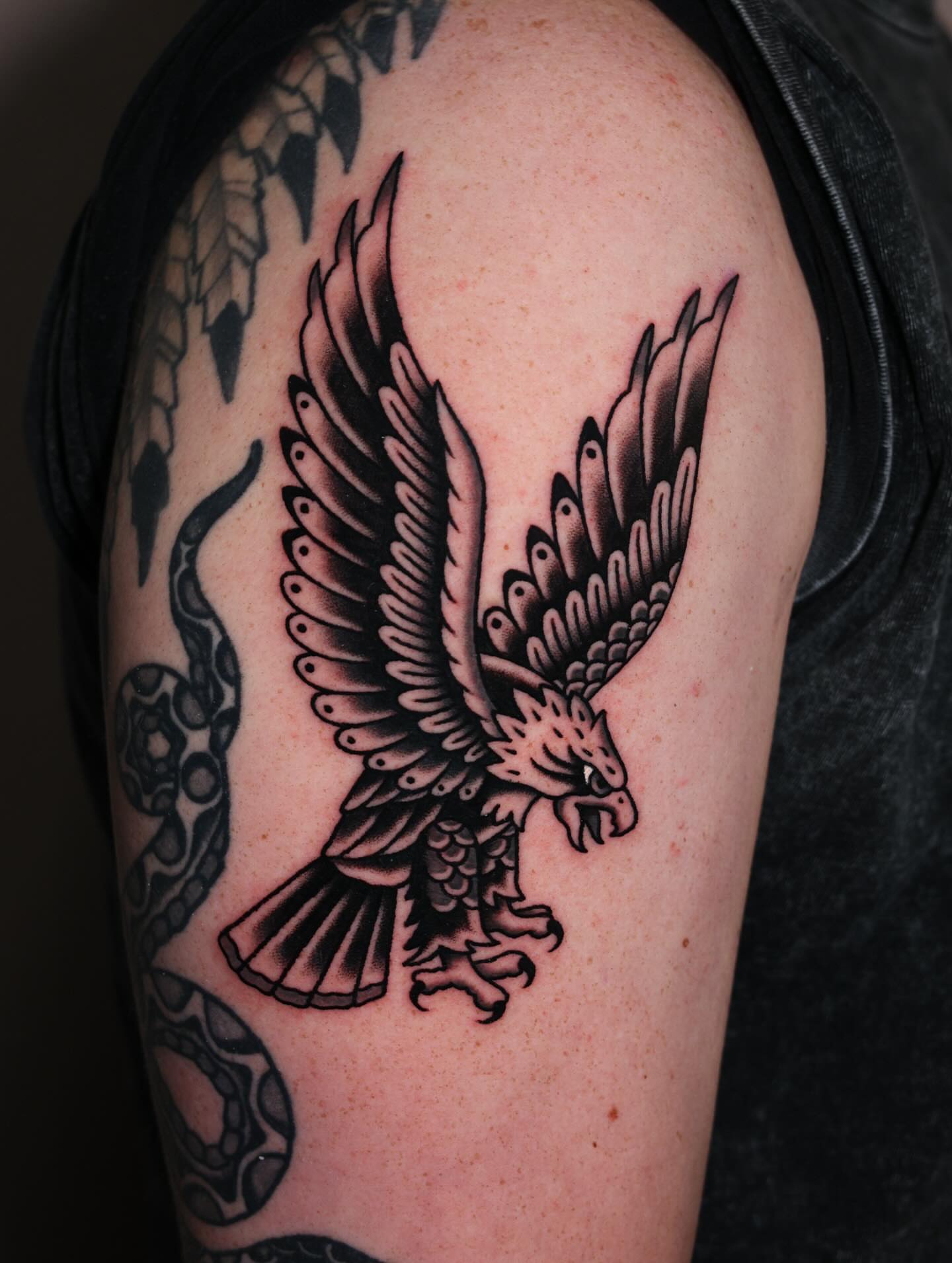 Eagle black and grey tattoo on the shoulder by Nova Vaughn