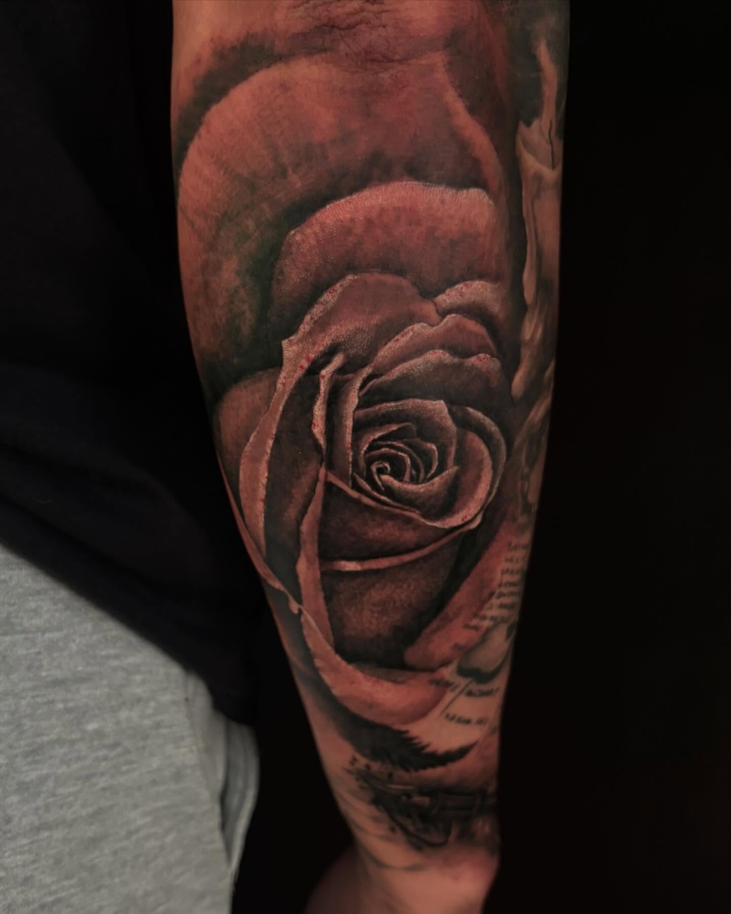Rose realism tattoo on the forearm by Trusty Dizon Tattoo Artist