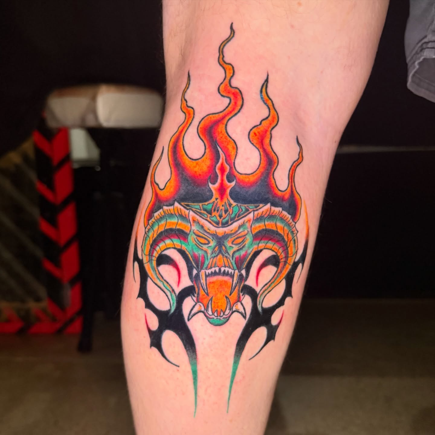 Flaming dragon head American traditional tattoo on the forearm by Chloe Peters 🦭🦄🏳️‍🌈
