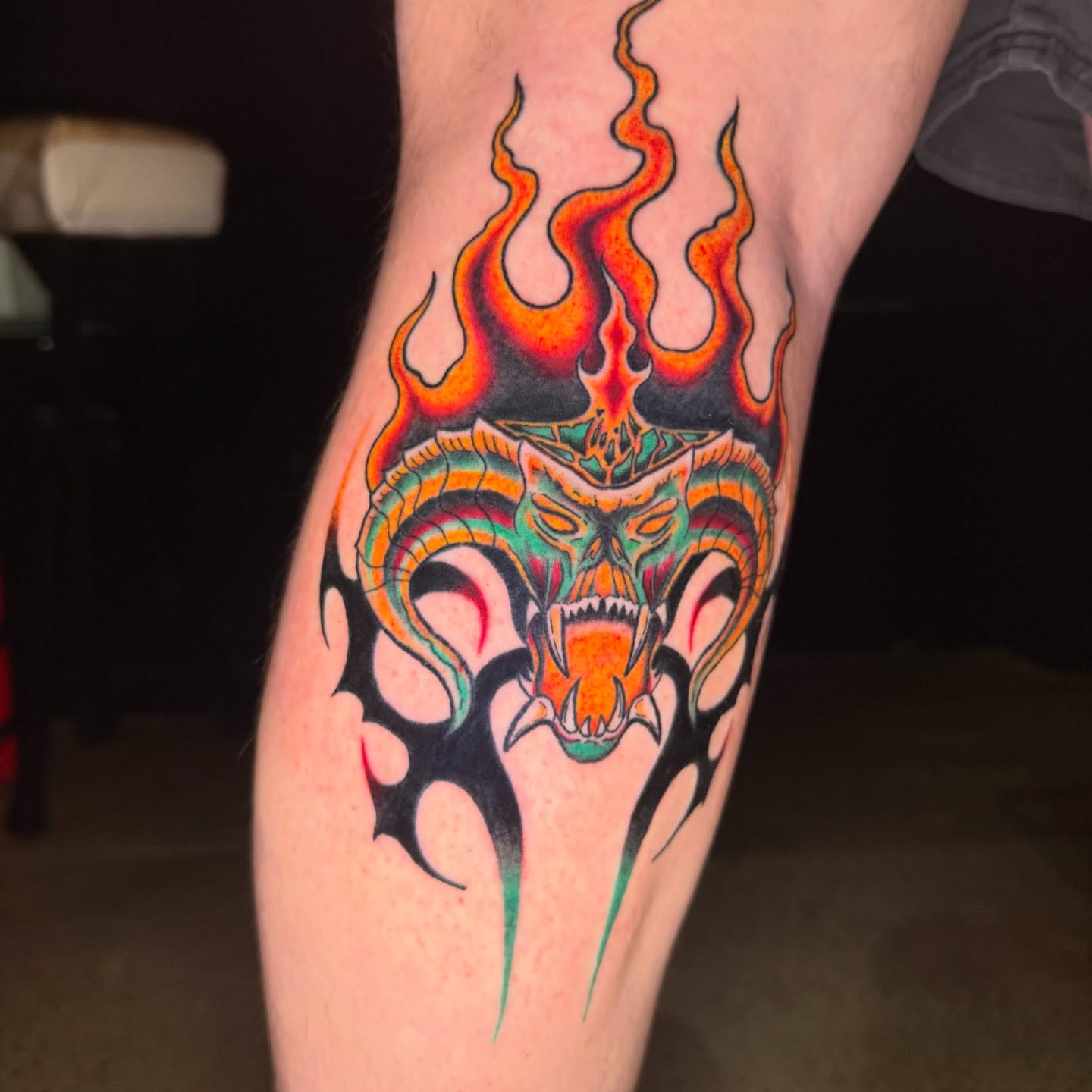 Flaming dragon head neo-traditional tattoo on the forearm by Chloe Peters 🦭🦄🏳️‍🌈