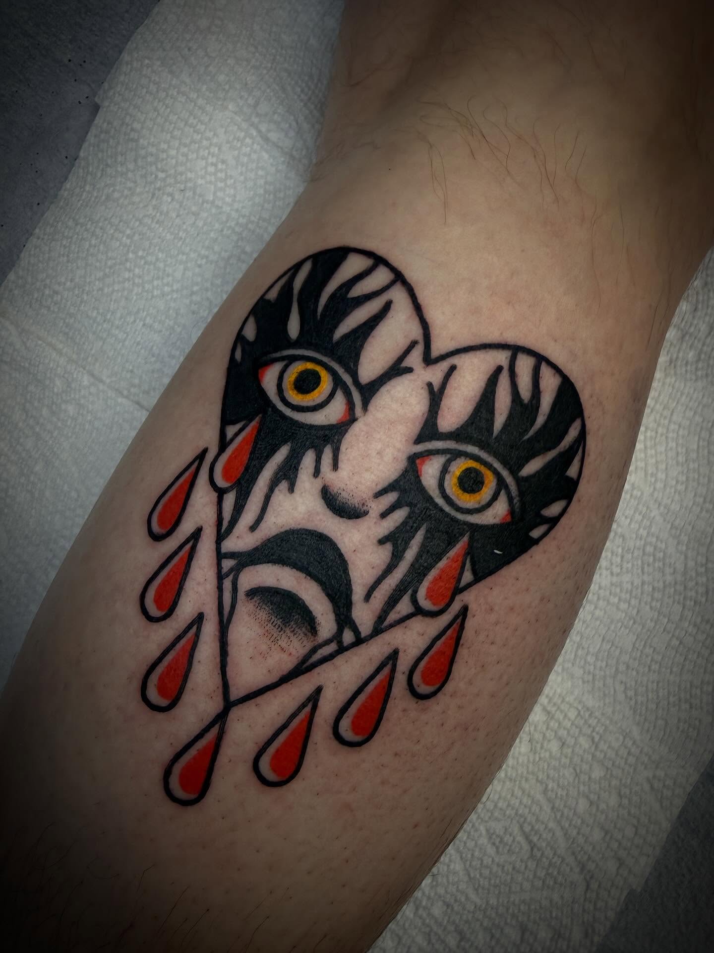 Tearful heart American traditional tattoo on the forearm by Andrew Slater
