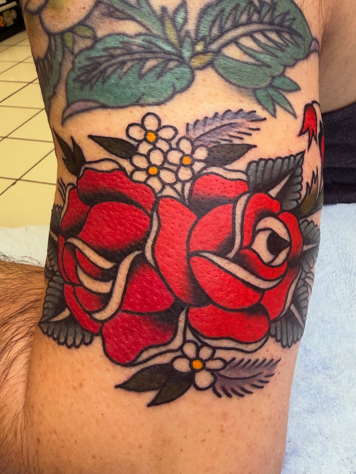 Red rose American traditional tattoo on the forearm by morganhabe