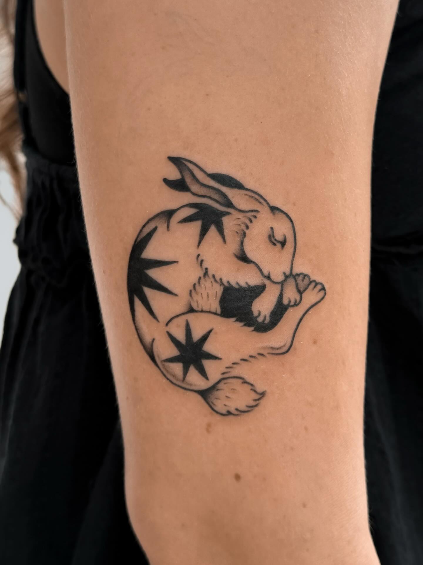 Rabbit black and grey tattoo on the forearm by nina