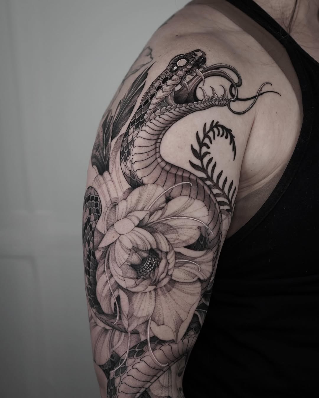 Tattoo by @inkidu_drew — realism, black_and_grey