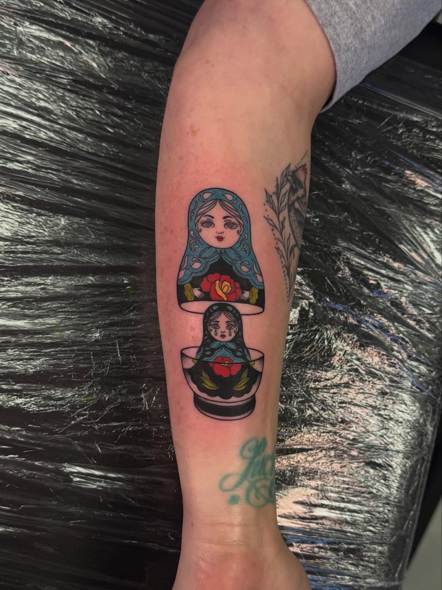 Matryoshka dolls American traditional tattoo on the forearm by haylie
