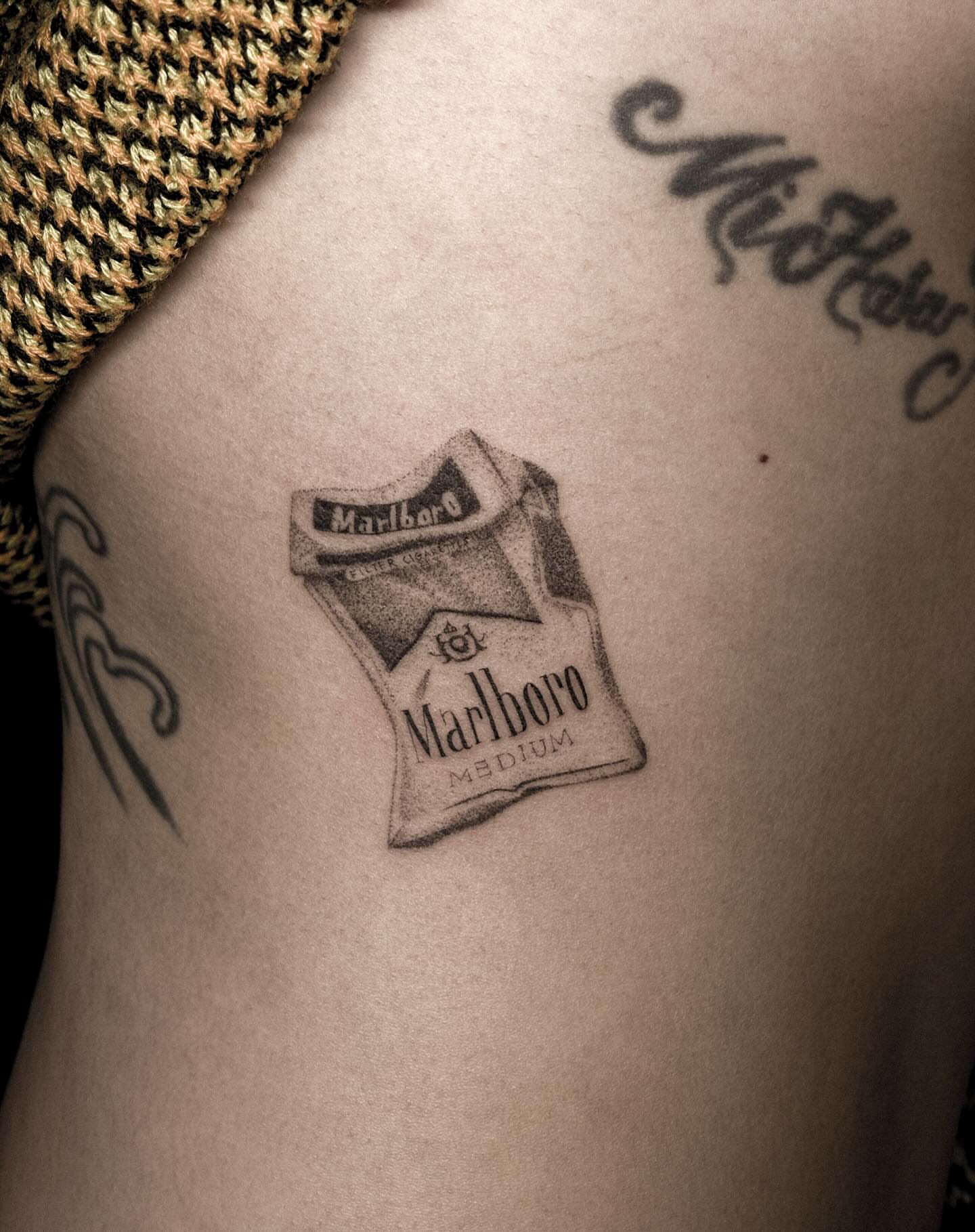 Marlboro cigarette pack black and grey tattoo on the ribs by ๐๐, Tacoma, Washington