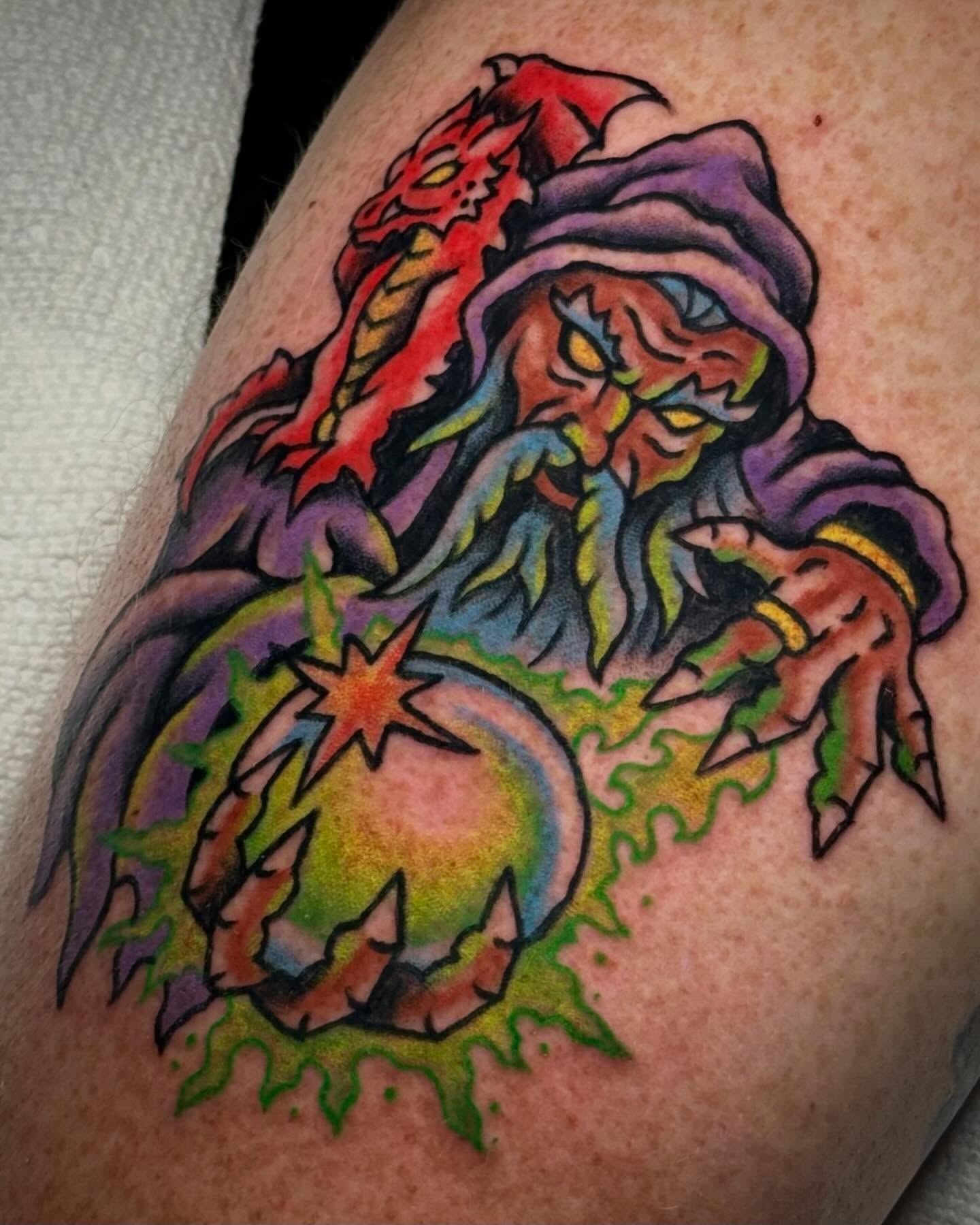 Demon with orb American traditional tattoo on the thigh by Ty Elias
