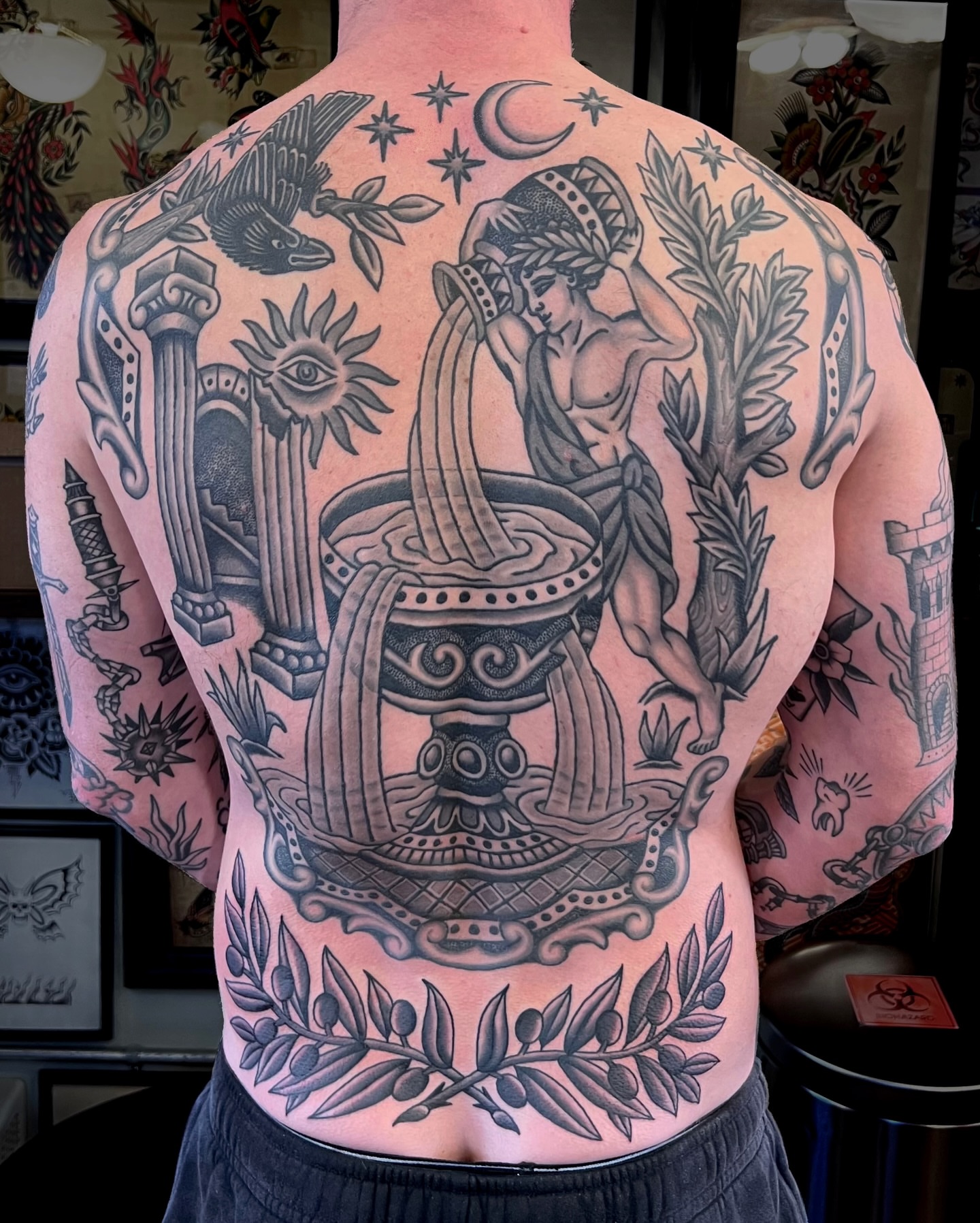Mythological figure with harp black and grey tattoo on the back by Brian Visser