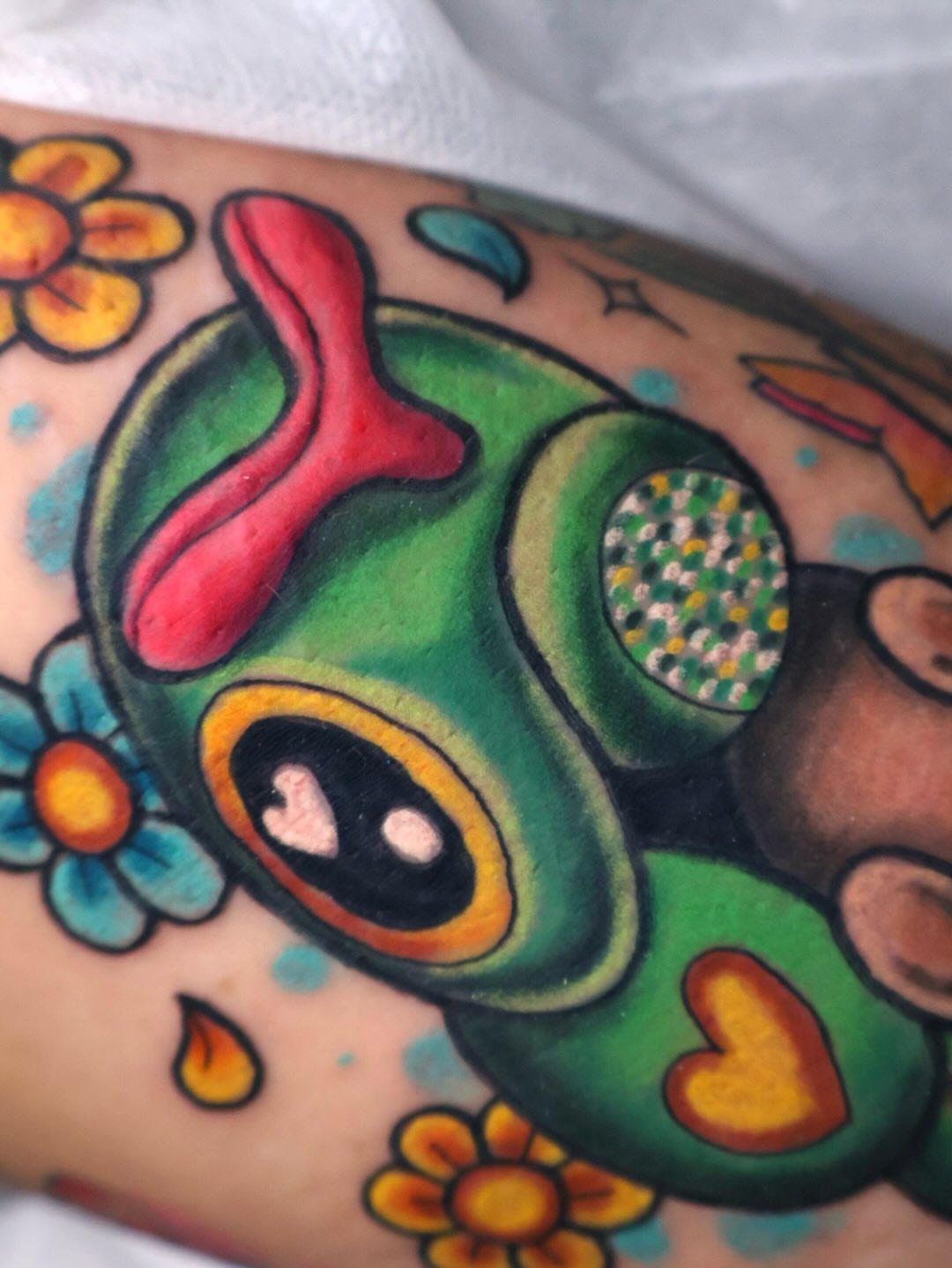 Frog American traditional tattoo on the forearm by Bailey Drey