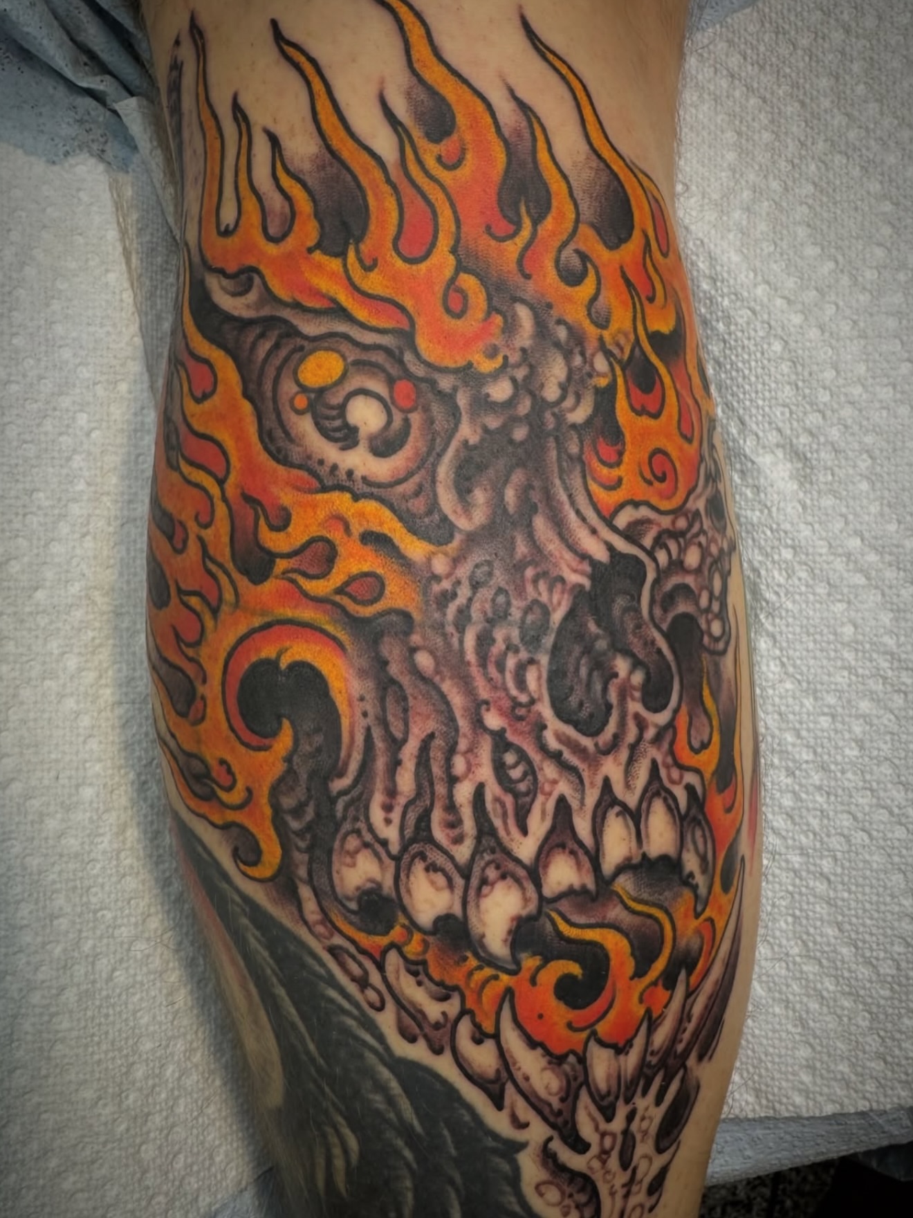 Flaming skull American traditional tattoo on the forearm by J Ranno, Richmond, Virginia