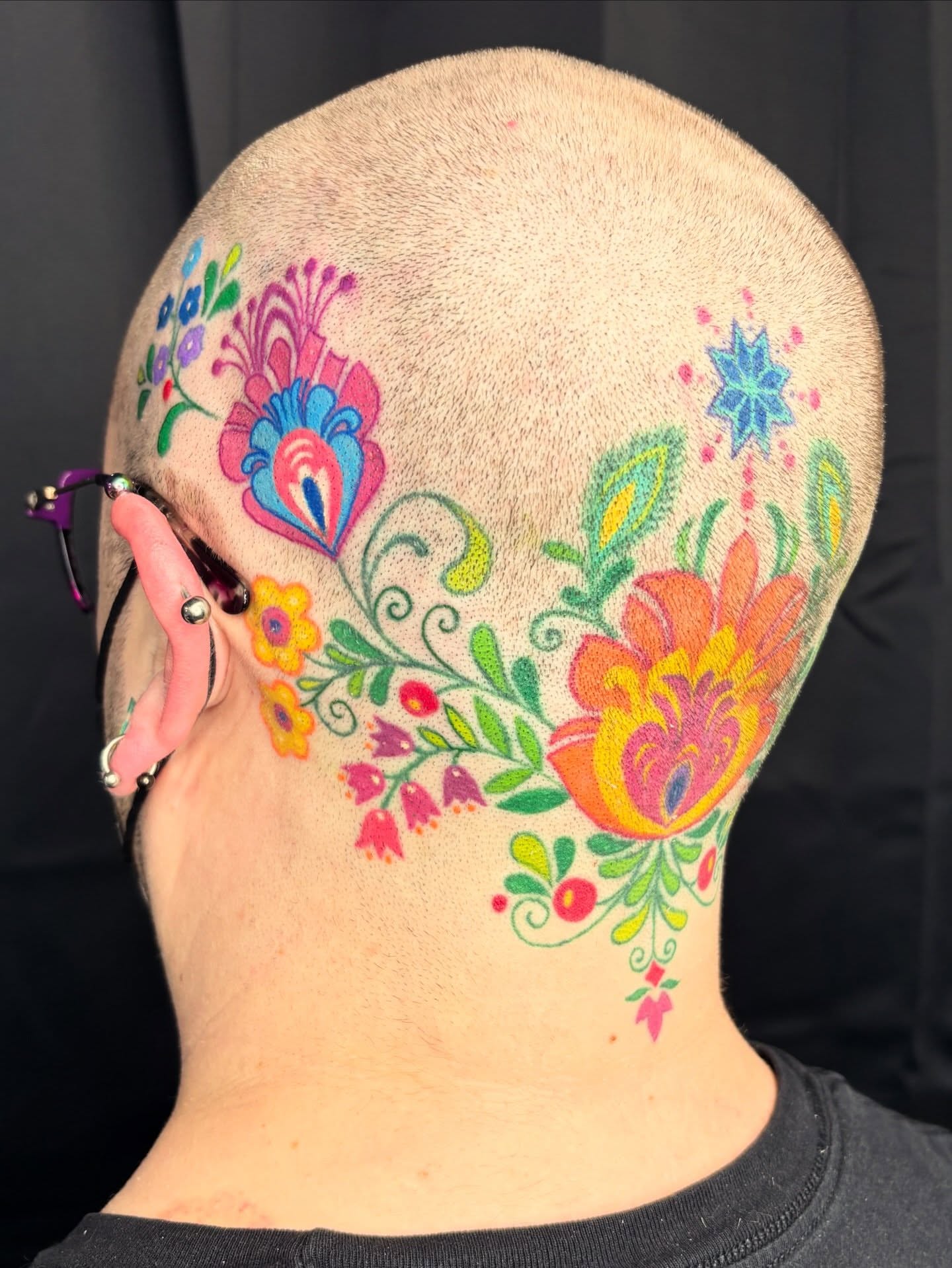 Floral design ornamental tattoo on the head by Lu Taylor, Minneapolis, Minnesota