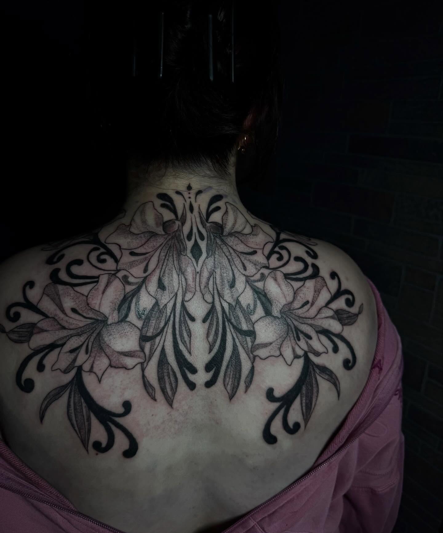Floral dotwork tattoo on the back by olivia reed