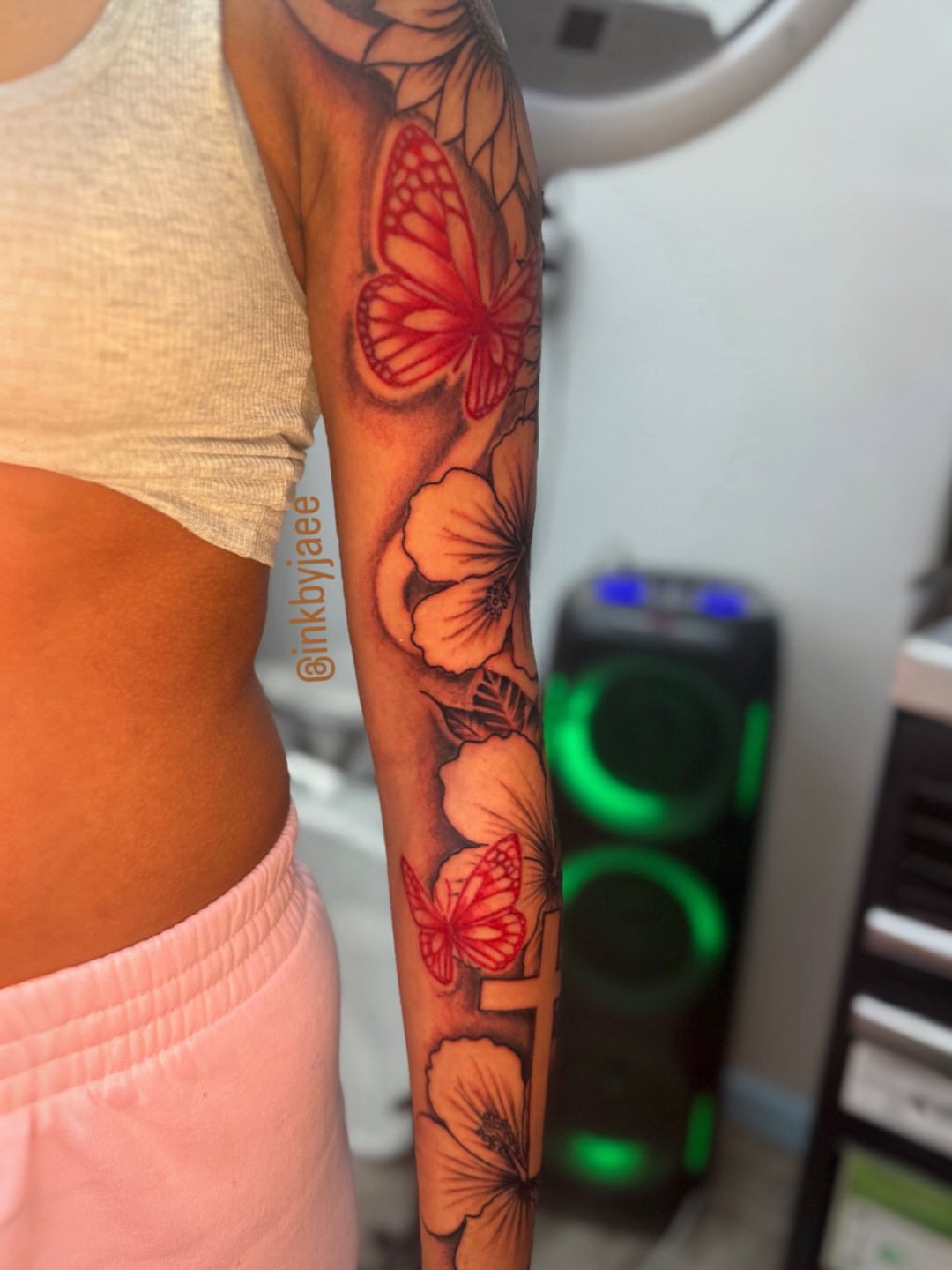 Butterflies and flowers realism tattoo on the forearm by JAE, Shreveport, Louisiana